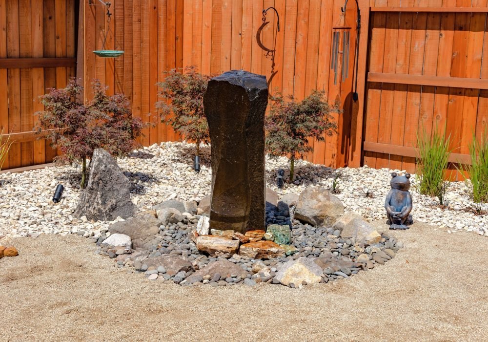 Cored basalt Pondless water feature by Gail Willey Landscaping