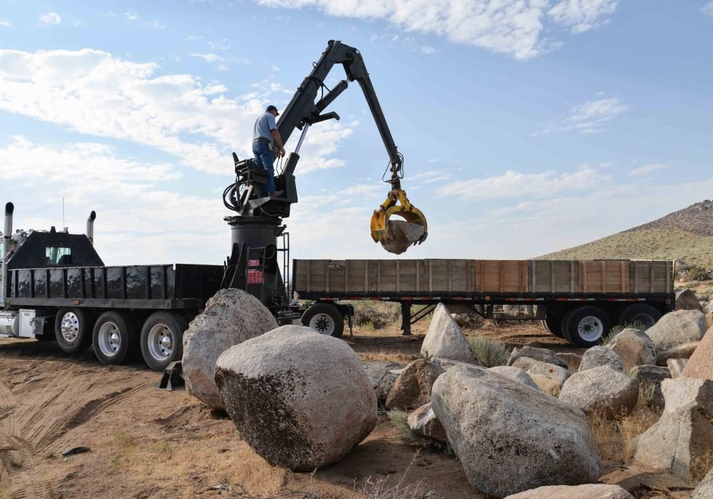 Rockpicker Harvesting unique boulders for Gail Willey Landscaping from the BLM boulder pit in Reno, Nevada