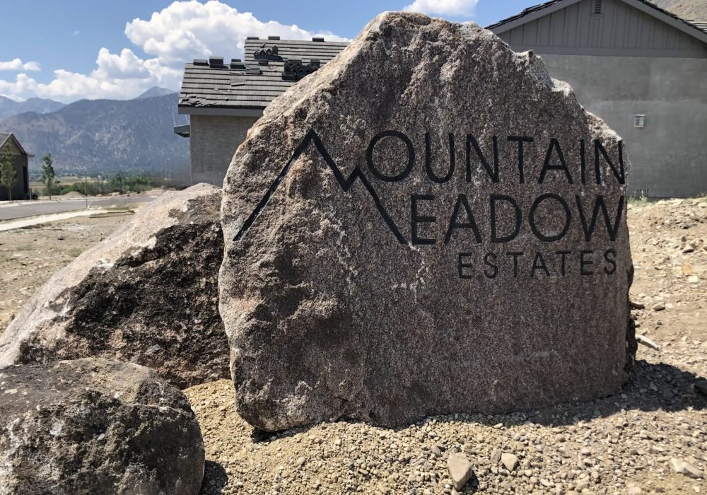 Cored and engraved Boulders with Name or address by Gail Willey Landscaping.