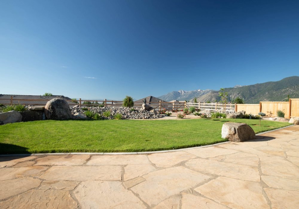 Flagstone patio with boulders Landscaping reno nevada tahoe california