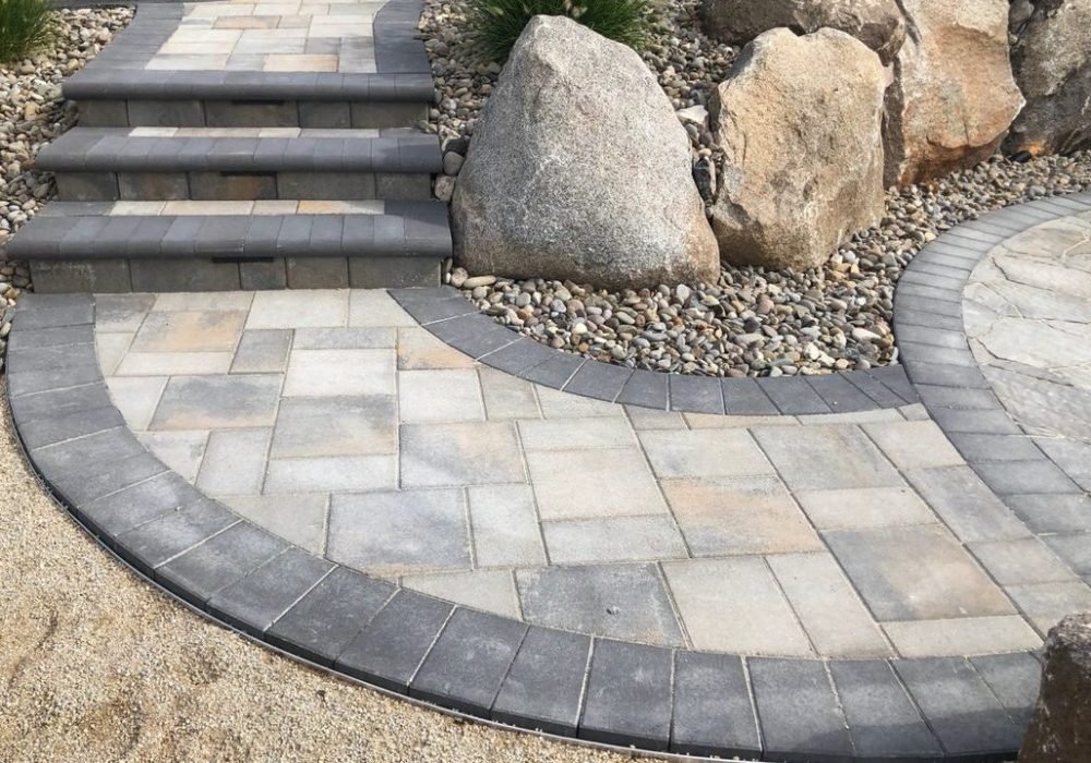 paver walkway with steps and boulders